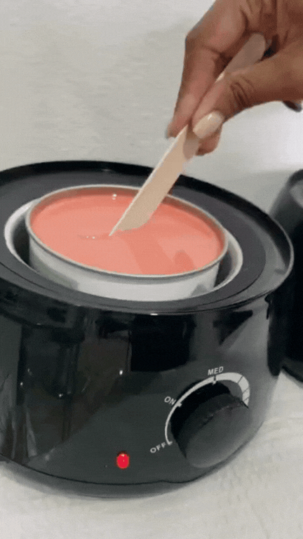 Waxxmii Rose Cream Soft Wax melted in professional wax warmer ready for use