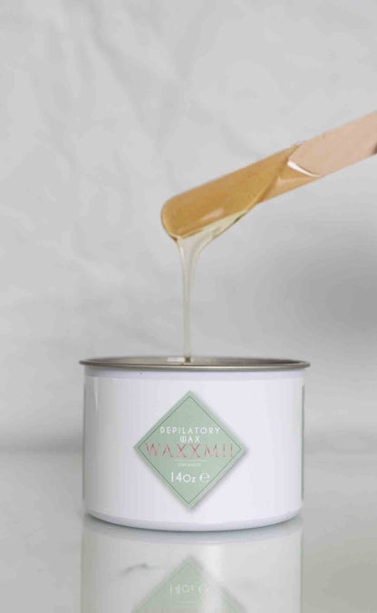 Waxxmii Honey Soft Wax consistency shown dripping from applicator stick